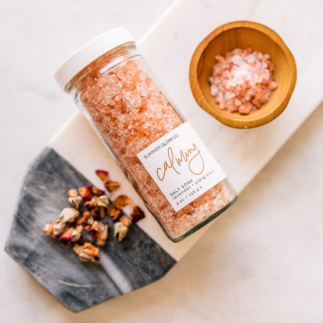 calming Salt soak on counter with flowers 